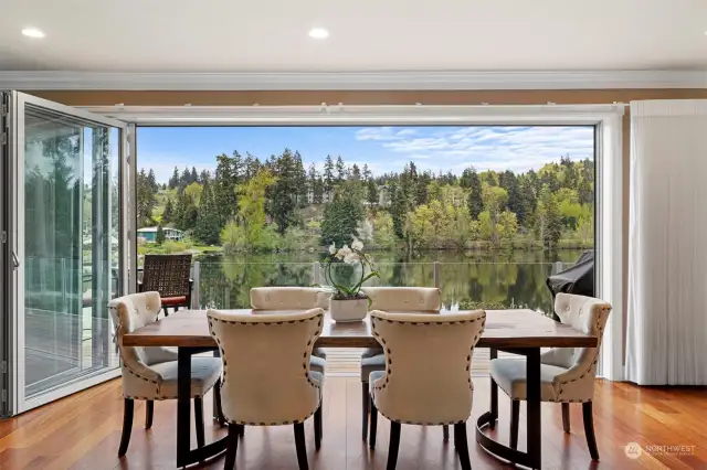 Beautiful dining room with Nano glass doors that open fully to connect you to the outdoors.