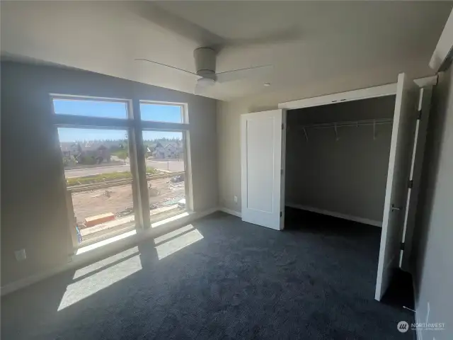 Bedroom #1 with fan + French Door to closet