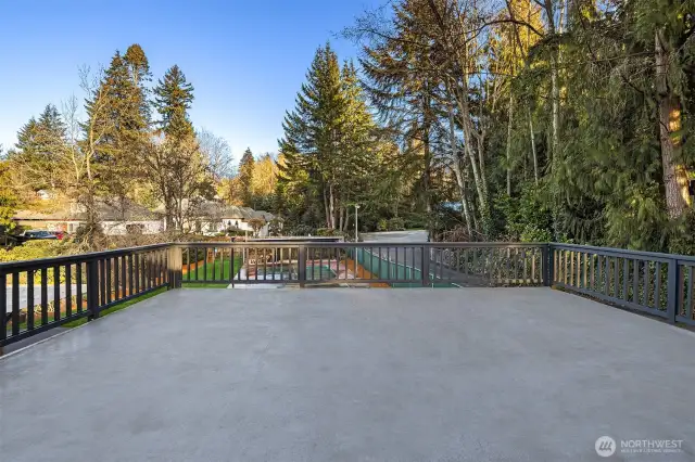 The deck overlooks the sports court and grounds.