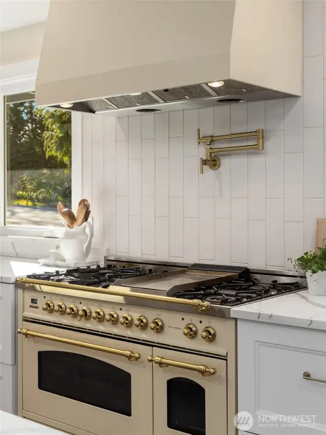 The gas stove is reminiscent of French Lacanche with its Olde World charm and its fabulous cooking "powers".