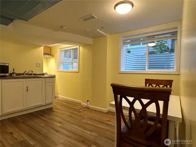 Lower level kitchen with eat in kitchen area.