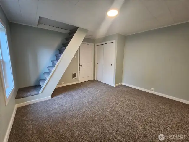 Stairs to a large attic storage space.
