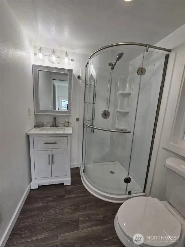 Brand new 3/4 bath off kitchen and mud room, and back door.