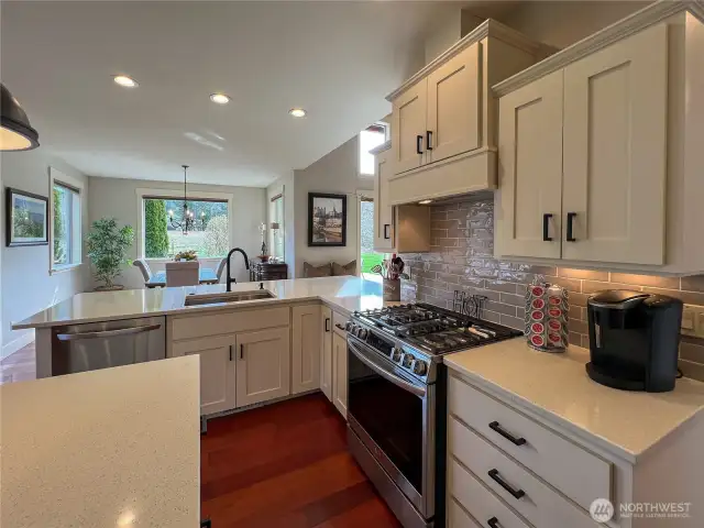 Kitchen has updated cabinets and counters.
