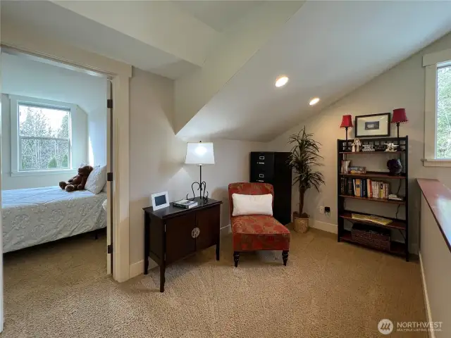 Additional sitting room perfect reading nook or play space on the upper level of the home.