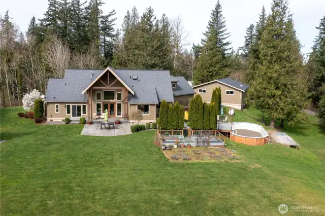 Meticulously maintained landscaping with dedicated gardening spaces.
