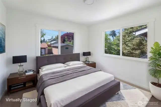 Nice bedroom with new carpet that faces spacious backyard.