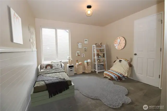 Generous-sized second bedroom upstairs.