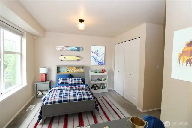 Generous-sized third bedroom upstairs.