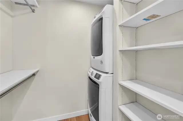 Full-sized stackable W & D within the walk-in closet.