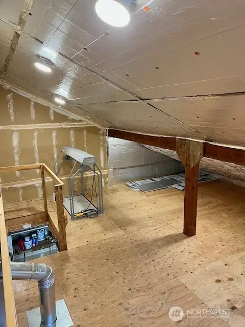 Pull-down stairs in the garage accesses roughly 300+ square feet of storage space. Potential access from guest bathroom on 2nd floor.