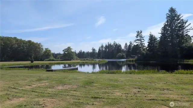 Private community access to tranquil Lake Loomis—where quiet waters meet forested shoreline, perfect for kayaking, fishing, or simply soaking in the serenity of nature.