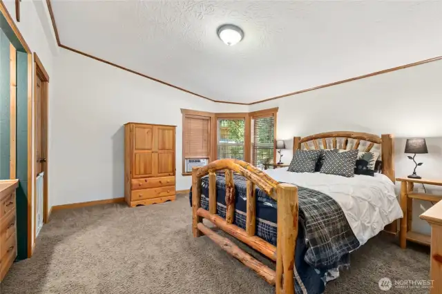 Primary Bedroom with walk in closet, built in dressing table and a primary bath