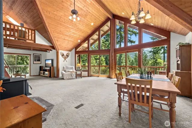 The expansive great room is the heart of the home—flooded with natural light and framed by jaw-dropping views. It seamlessly connects to the family room, dining area, and chef’s kitchen, which features custom cabinetry, granite counters with breakfast bar, stainless steel appliances, and two pantries (including a walk-in!).