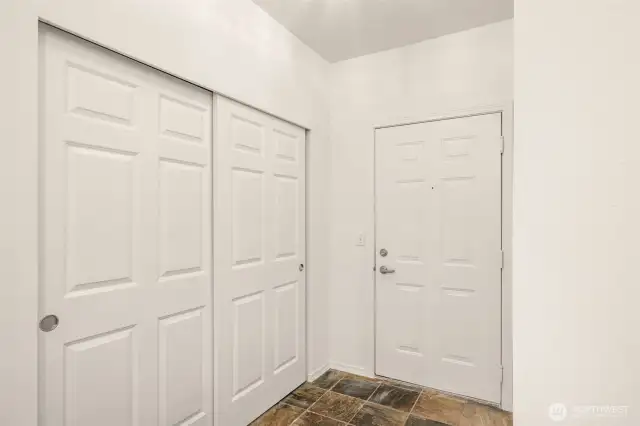 Entry with large closet and slate flooring