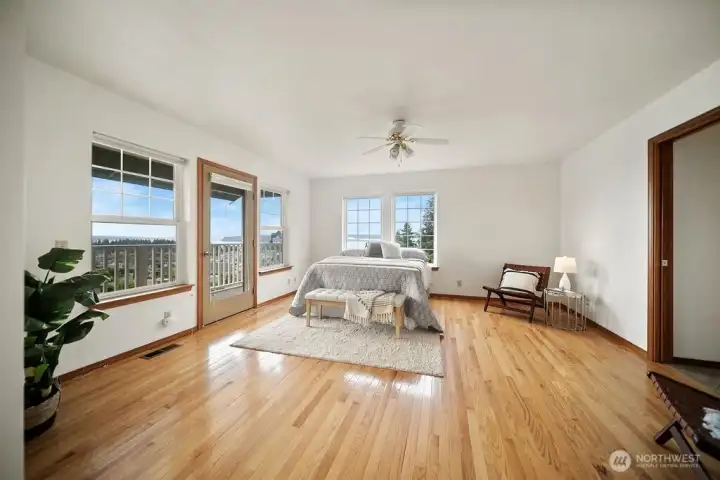View as you enter form the second floor hallway into the primary bedroom and bath.