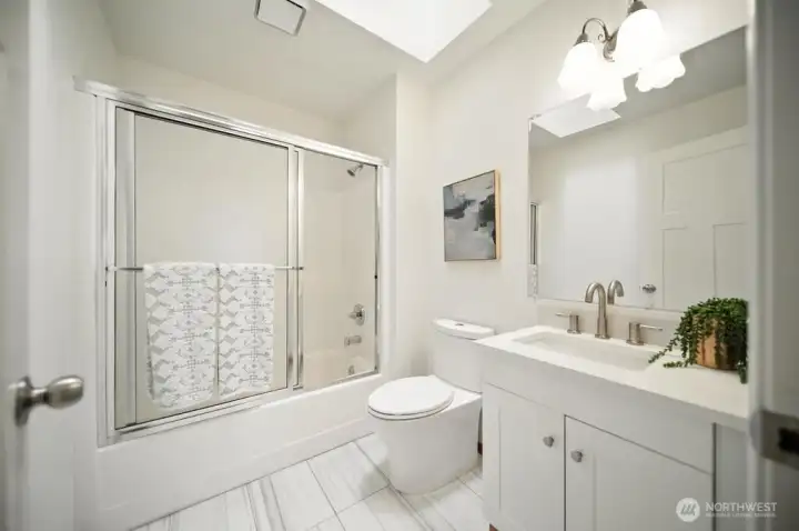 Second floor main bath conveninet to bedroom 2 and office/additional bedroom. This has just been refreshed with new vanity, toilet and tile floors.