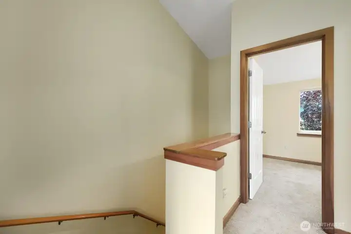 Hallway to the upper floor with 2 Bedrooms and a Full Bath.