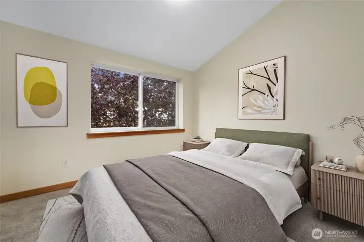 The second Bedroom upstairs on the opposite side faces West towards a Treed outlook.