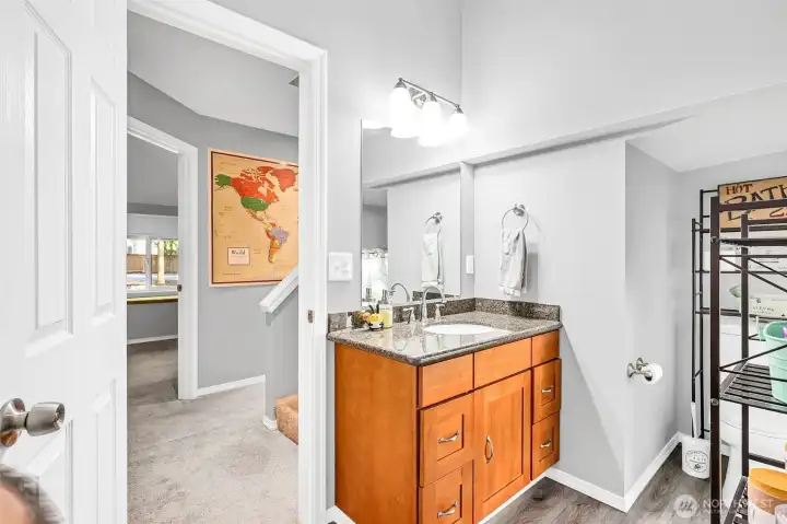 Across from the secondary bedroom is an updated full bathroom. Granite counters on the vanity with undermount sink, newer fixtures & light, lvp floors plus new tile surround in the shower