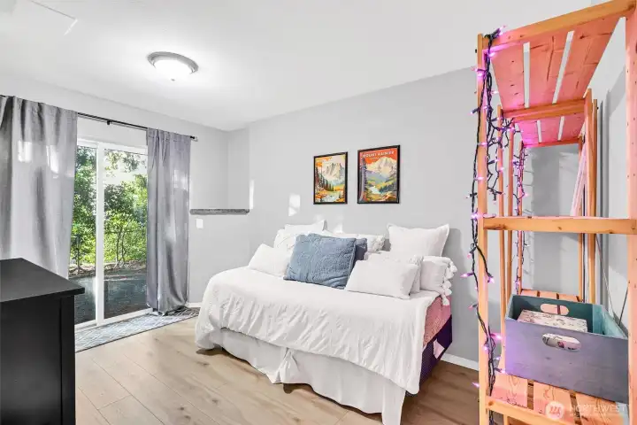 The daylight basement can be a large secondary suite or used as a bonus room, office or whatever you need. The sliding glass doors lets in natural light & leads to the backyard