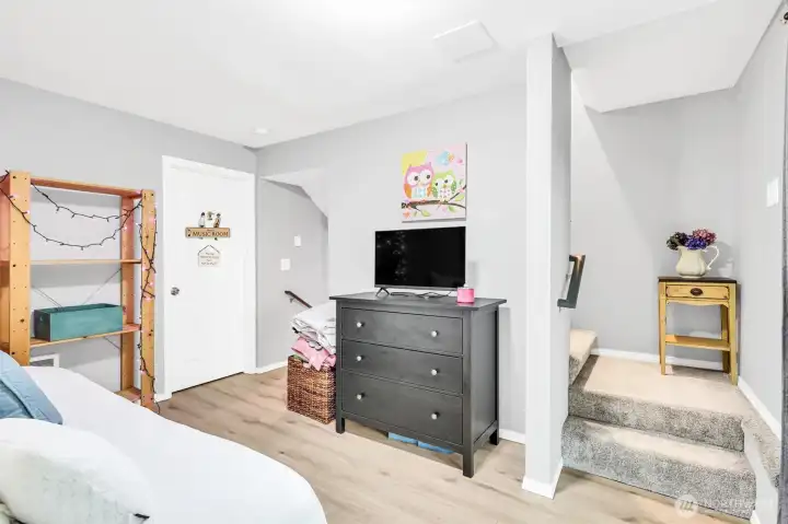 Daylight basement. The stairs lead down to the closet & 3/4 bath. The door leads to the den