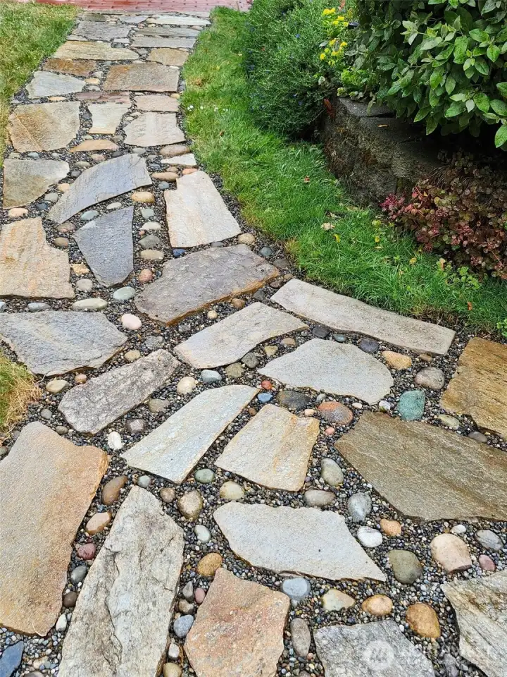Flagstone and river rock path from main home to caretaker unit