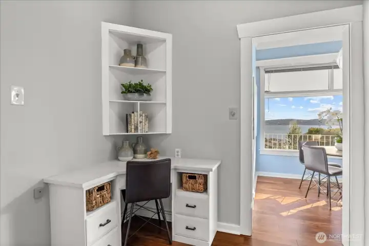 Kitchen is a blank canvas but currently offers small office or homework nook.