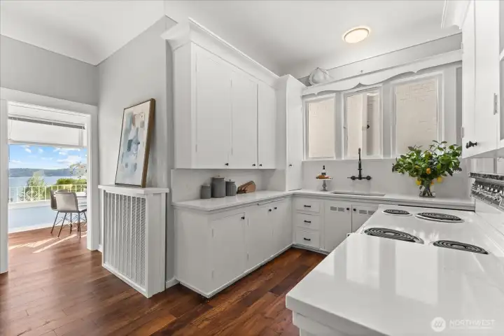 Kitchen opens to an informal dining space.