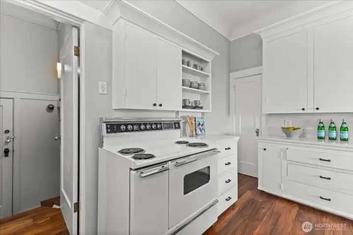 Entrance to downstairs towards back of kitchen.