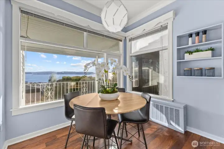 Informal dining space opens to one of many decks and captures the view.