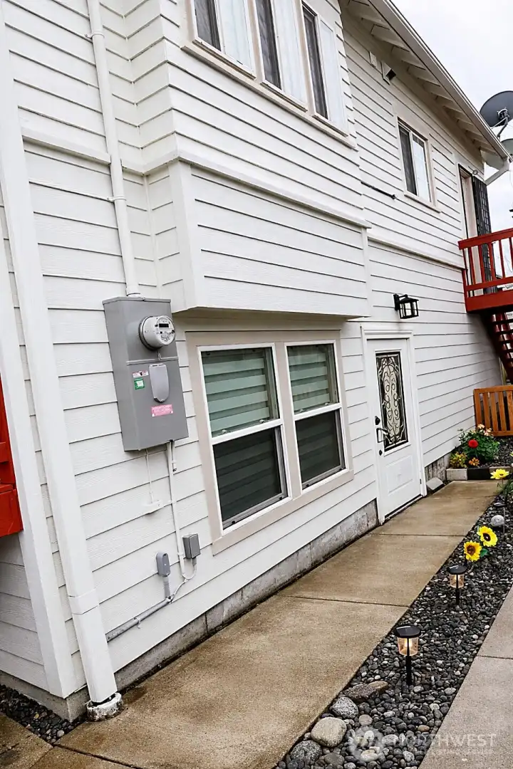 Lower level separate entry. Photo virtually enhanced to illustrate entry visibilityvisibility