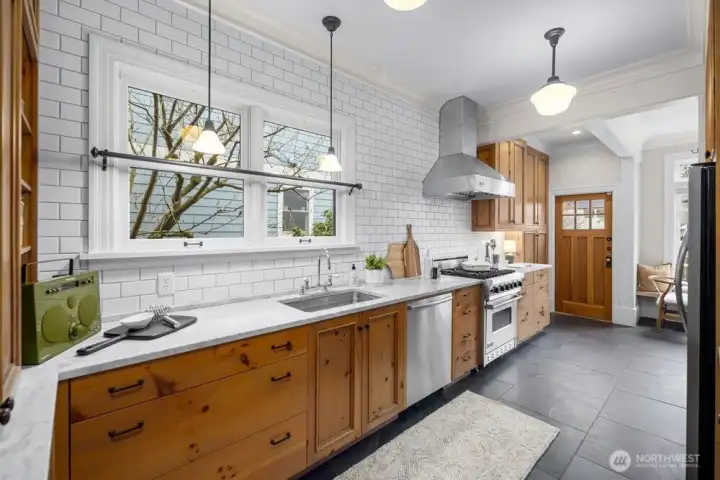 Light and bright with high-end appliances and abundant and intentional cabinet and counter space