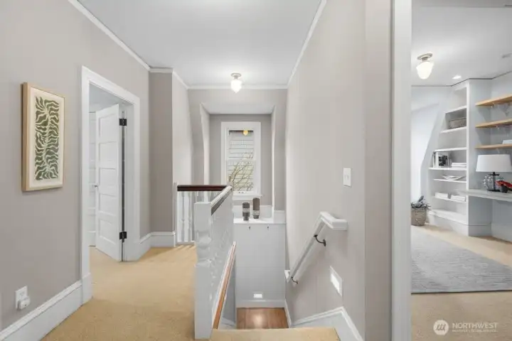 Upstairs hallway is open and bright
