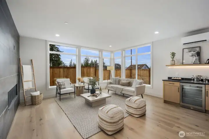 Beautiful engineered floors, fully tiled gas fireplace and tons of light