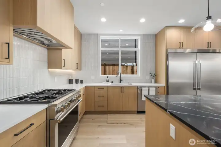 I love all the light wood cabinets