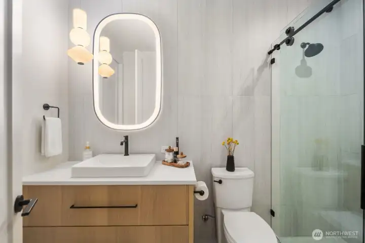 Fully tiled 3/4 bath off main floor bedroom