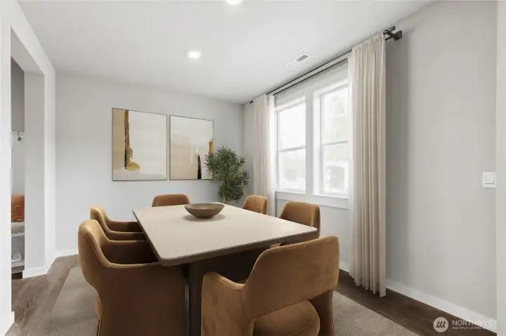 Formal dining area off main entrance. Virtual staging for representation purposes.