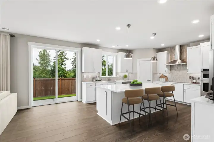 Virtual staging - sleek wide plan flooring, open concept living and kitchen that opens out to patio and fully landscaped/fenced yard.