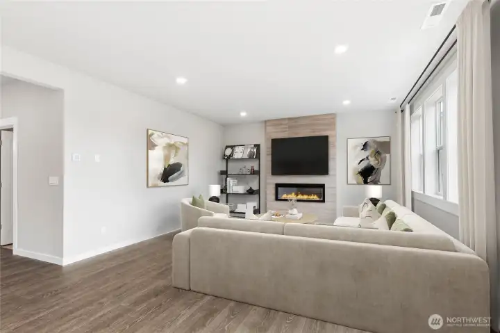 9'ceilings in living area.  Electric fireplace and tiled feature wall.  Virtual staging