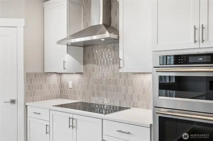 Modern induction cooking plus full height tile backsplash
