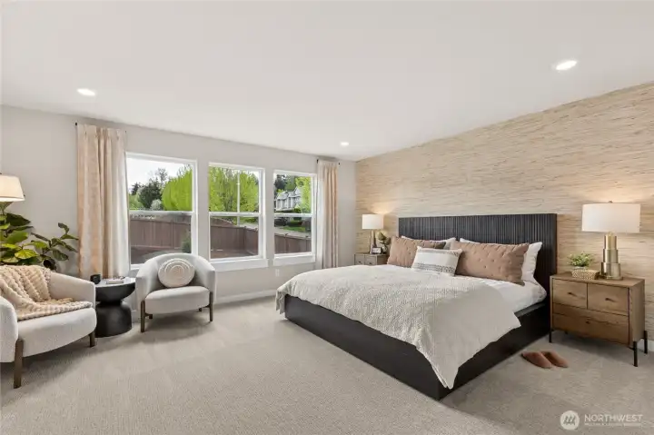 Top floor primary suite with oversized windows allowing for lots of light.