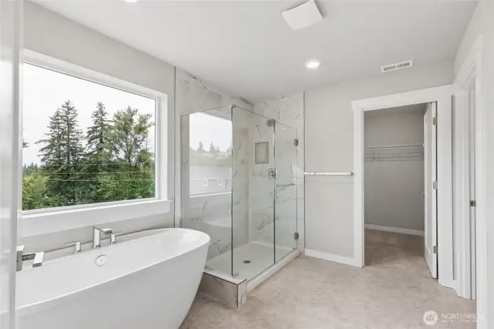 Sumptuous soaking tub in top floor primary suite.