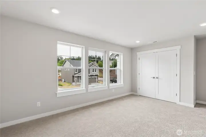 Large bonus room or 6th bedroom faces south and is light and bright!