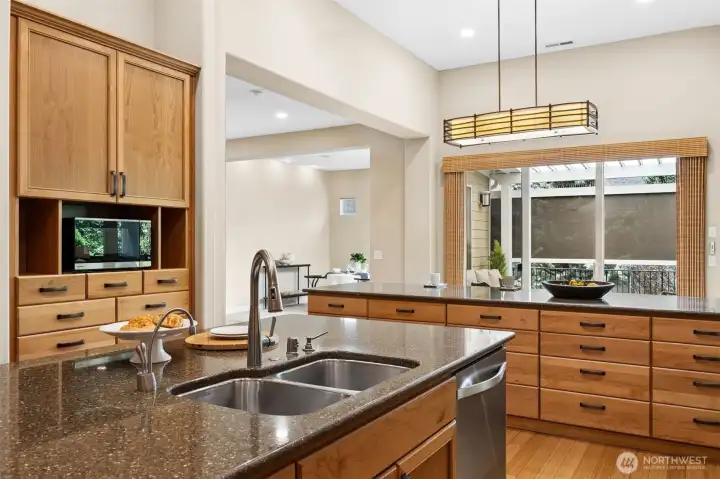 Lots of natural light and built-ins. The second island with bar seating houses 20 storage drawers