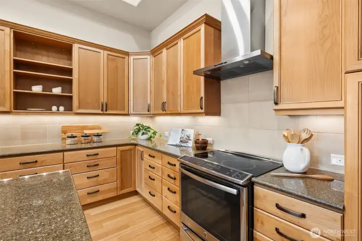 Under cabinet lighting adorns the exceptionally abundant cabinetry