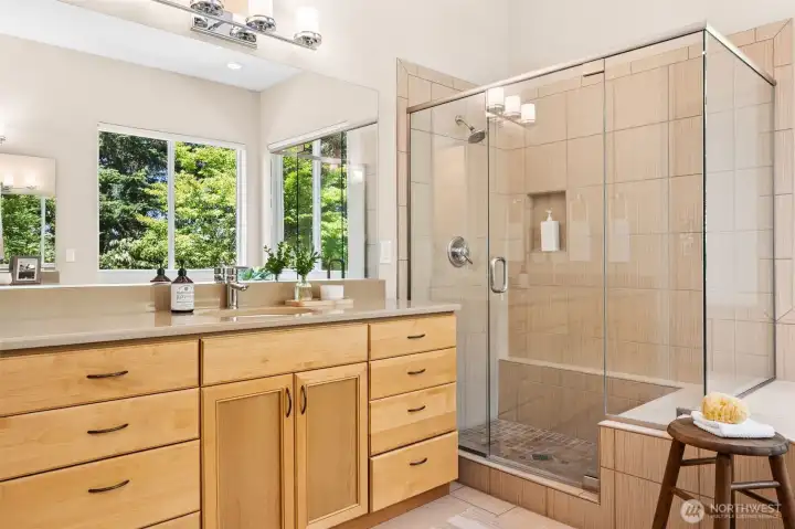 Walk-in shower with tile surround and built-in seat