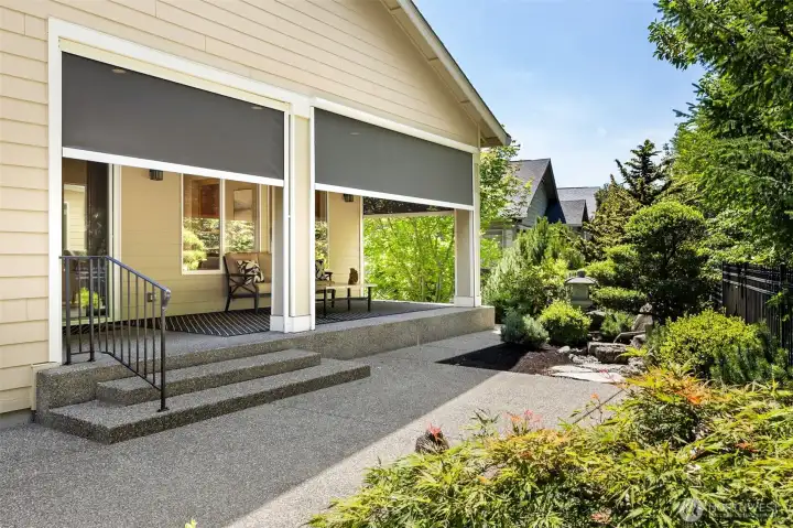 2 large aggregate concrete patios offer uncovered areas for additional patio furniture