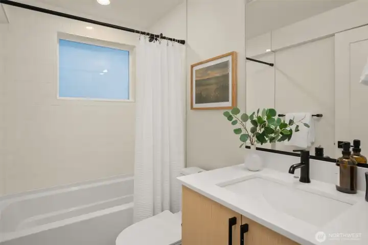 A full bath located on the ground level completes the living space for a convenient living area. A full bath located on the ground level completes the living space for a convenient living area.