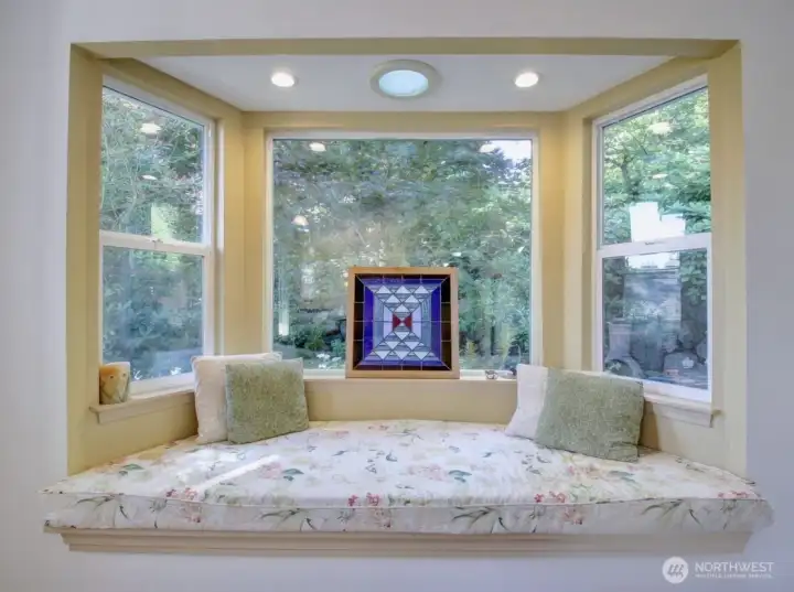 Beautiful Bay window sitting nook, Perfect for admiring the Peaceful backyard or curling up with a book.